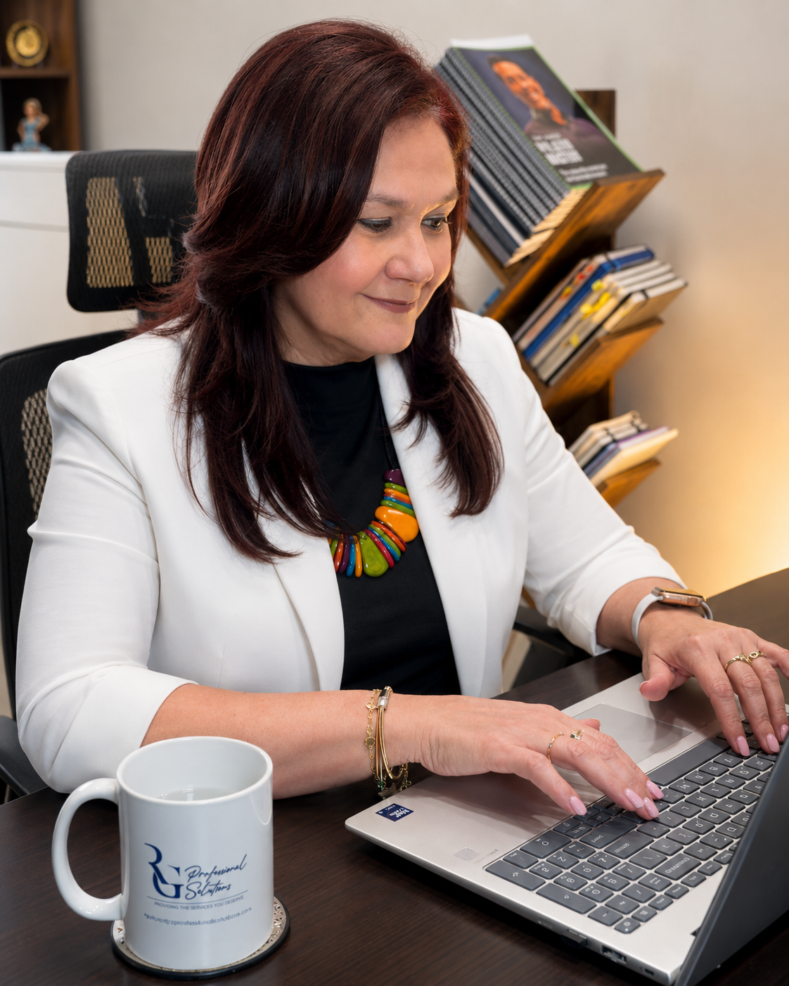 Rosy Galano working at her desk